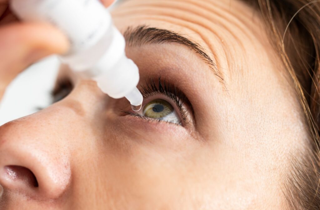 Person applying eye drops